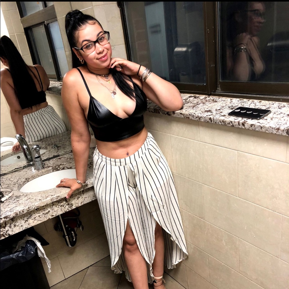 White and black striped flowy pants .